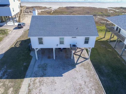 Elevated utility on the exterior of a beachfront home.